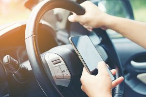 Driving while holding a mobile phone to work